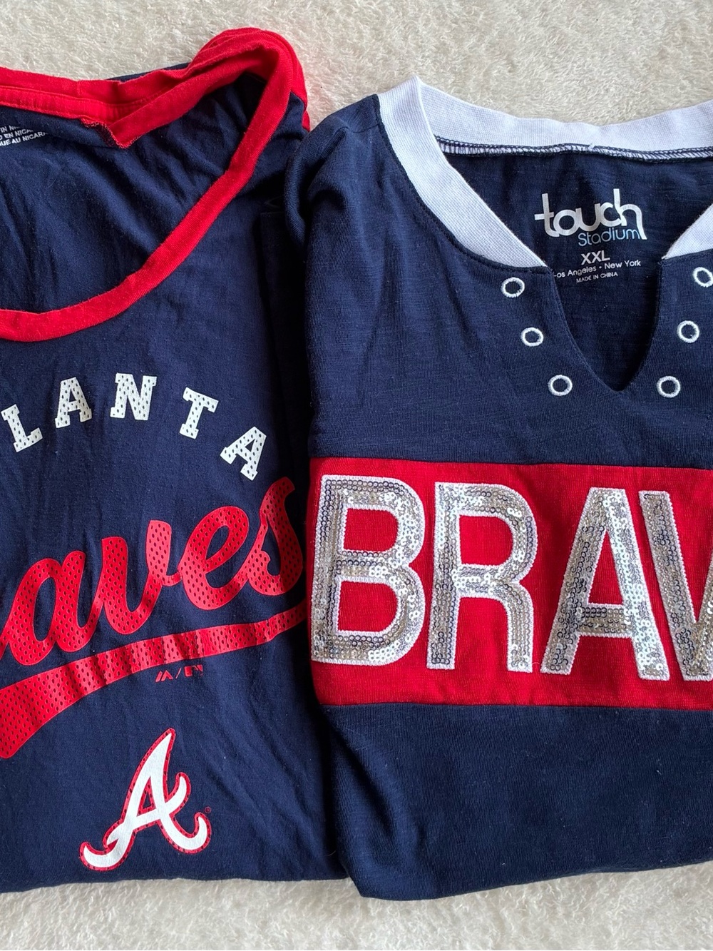 2 Women’s Atlanta Braves T-shirts, one XL and one XXL